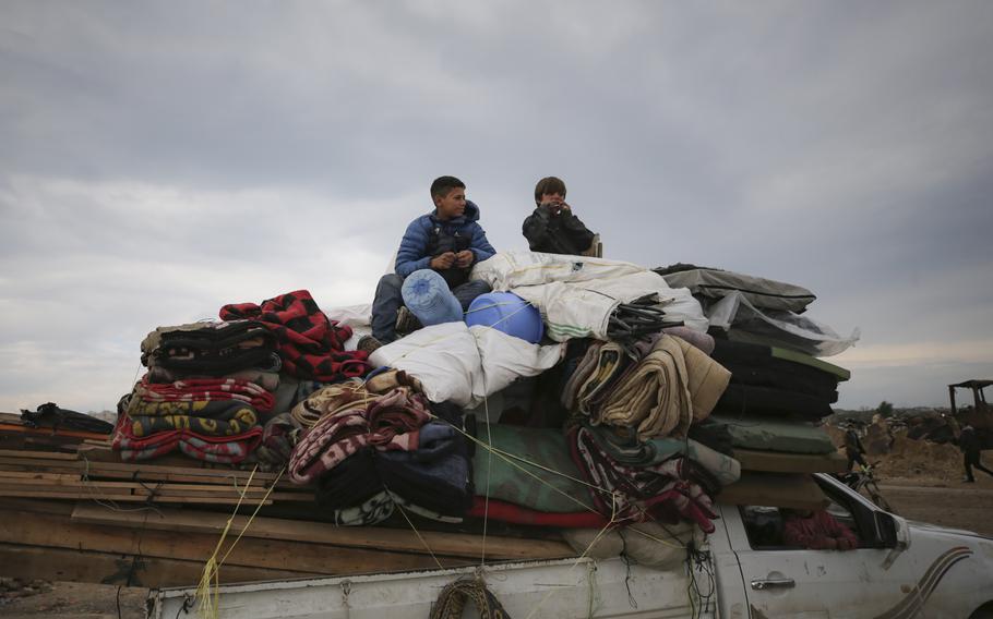 Displaced Palestinians make their way from central Gaza to their homes in the northern Gaza Strip