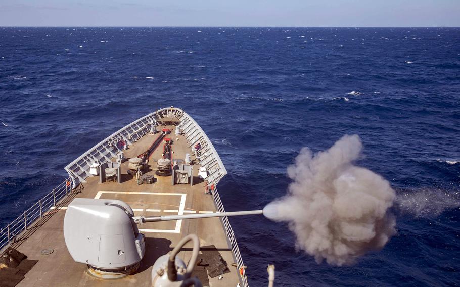 The cruiser USS Gettysburg fires a Mark 45 5-inch gun.