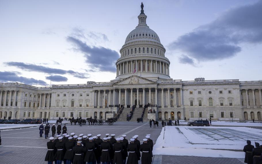 Jimmy Carter’s casket is carried up the steps of the Capitol.