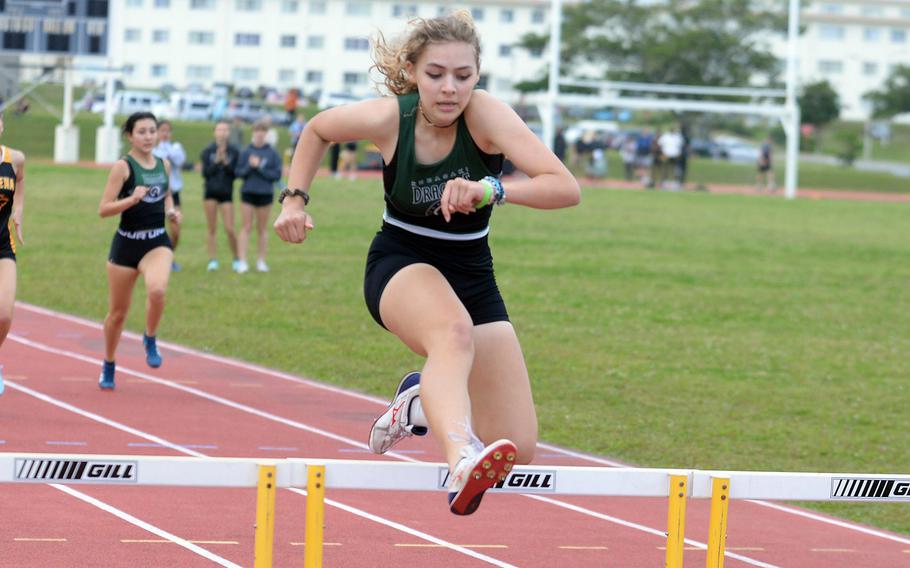 Kubasaki's Isabella Suber navigates the 300 hurdles during Friday's first day of a two-day Okinawa track and field meet. Suber won the event in 54.69 seconds. 