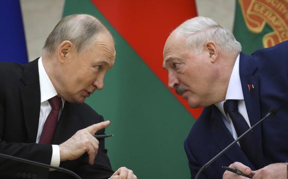 FILE - Russian President Vladimir Putin, left, and Belarusian President Alexander Lukashenko talk during a signing ceremony in Minsk, Belarus, Dec. 6, 2024. (Gavriil Grigorov, Sputnik, Kremlin Pool Photo via AP, File)