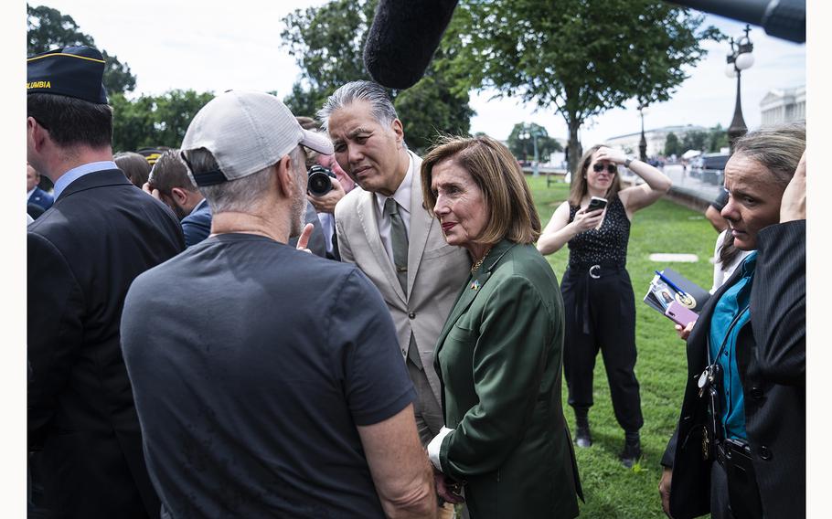 Rep. Mark Takano, D-Calif., and then-House Speaker Nancy Pelosi, D-Calif., speak with comedian Jon Stewart in 2022 in Washington, D.C.