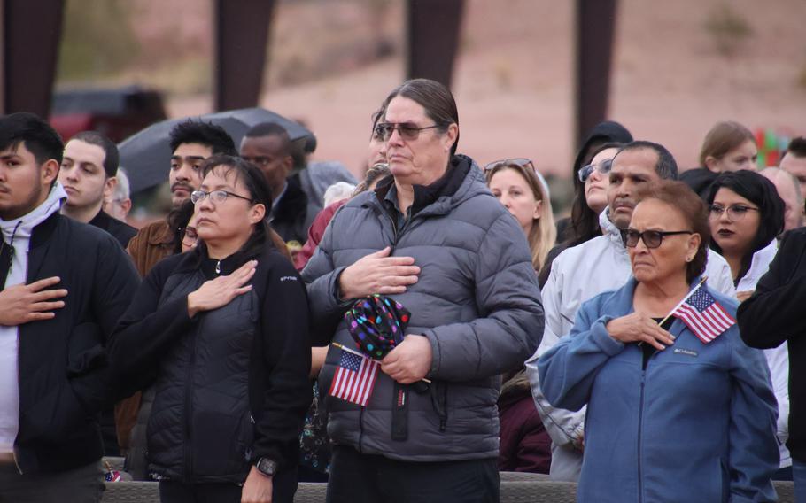 More than 150 service members of the 856th Military Police Company from the Arizona Army National Guard rally together with their families on Bushmaster Field in Phoenix, Ariz., for an send-off ceremony Sunday, Jan. 21, 2024. 