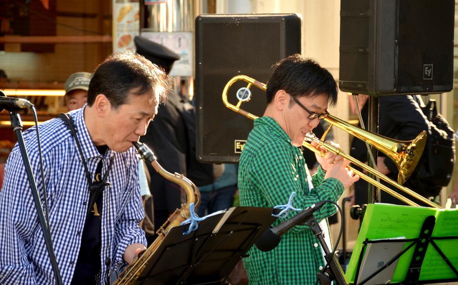 Members of OM Connection perform outside Mikasa Shopping Plaza in Yokosuka, Japan, Nov. 3, 2024. 