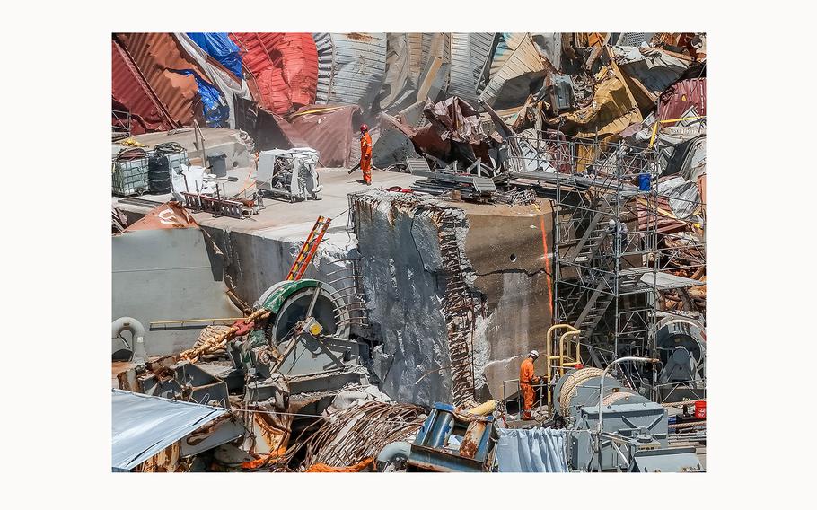 Salvage experts continue to clear the large amount of wreckage on the bow of the container ship Dali, twelve weeks after the collapse of the Francis Scott Key Bridge, on June 19, 2024, in Baltimore. 