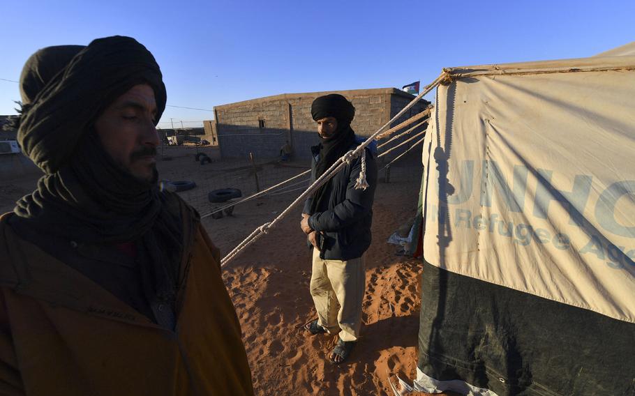 In this photo from Jan. 14, 2023, displaced Sahrawis gather at the refugee camp of Dakhla, which lies some 170km to the southeast of the Algerian city of Tindouf. The Polisario movement, which seeks independence in disputed Western Sahara, started meeting on January 13 for leadership elections in the shadow of mounting tensions between host Algeria and Morocco, which controls most of the territory. More than 2,200 members of the movement and 370 foreign guests are attending the five-day congress deep in Algeria's desert, at a Sahrawi refugee camp named after Dakhla, an Atlantic port city in what is Moroccan-controlled Western Sahara.