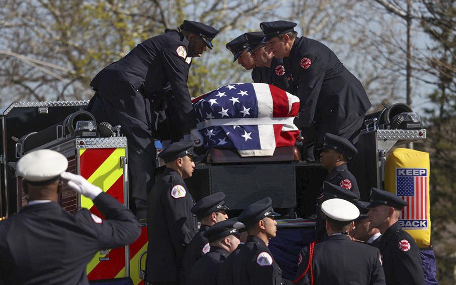 Firefighters carry the casket of Chicago Fire Department Lt. Jan Tchoryk, who died, April 5, 2023, as he led a ladder crew in a staircase trying to put out the wind-driven blaze at 1212 N. DuSable Lake Shore Drive.