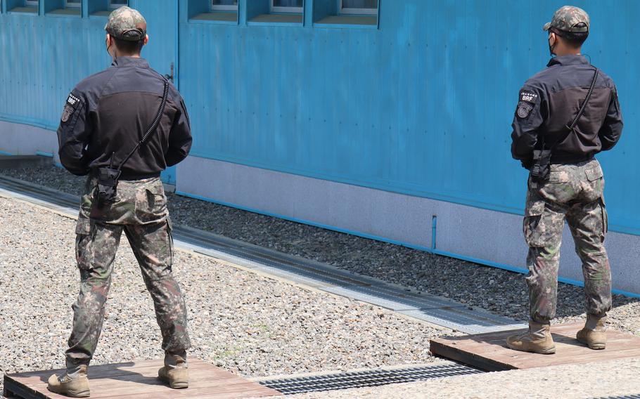 South Korean soldiers stand guard at the Joint Security Area inside the Demilitarized Zone in May 2023. 
