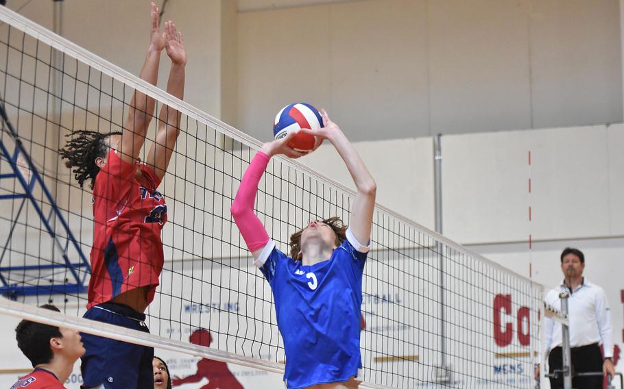 Sigonella's Jakub Piniewski sets the ball while Aviano's Andrew Walker prepares to block on the other side of the net Saturday, Oct. 5, 2024, at Aviano Air Base, Italy.