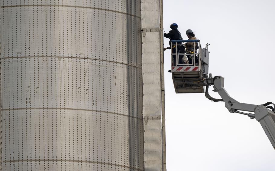 Workers prepare the SpaceX Starship and Super Heavy rocket on April 18, 2023.