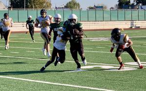 Naples' Leishieh Morgan carries the football during the DODEA European Division II title game on Saturday, Nov. 2, 2024. Morgan, who had 12 carries for 103 yards and two touchdowns, was named the game's most valuable offensive player.