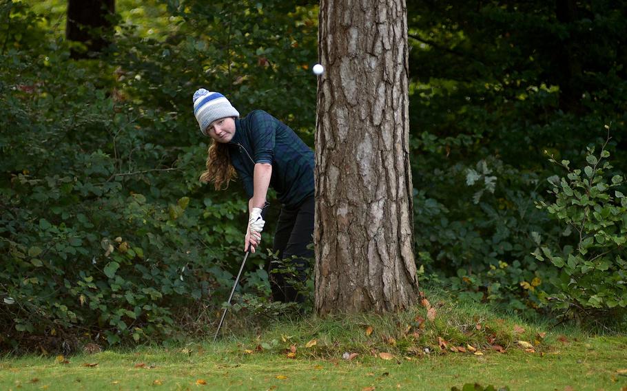 Morgan Johnson hits around a tree.