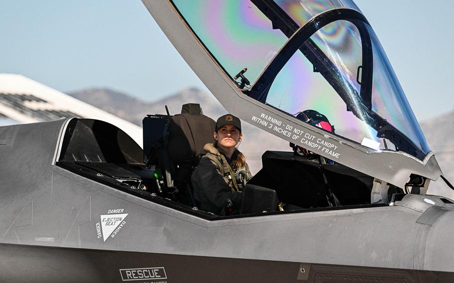 A pilot looks out of her cockpit.