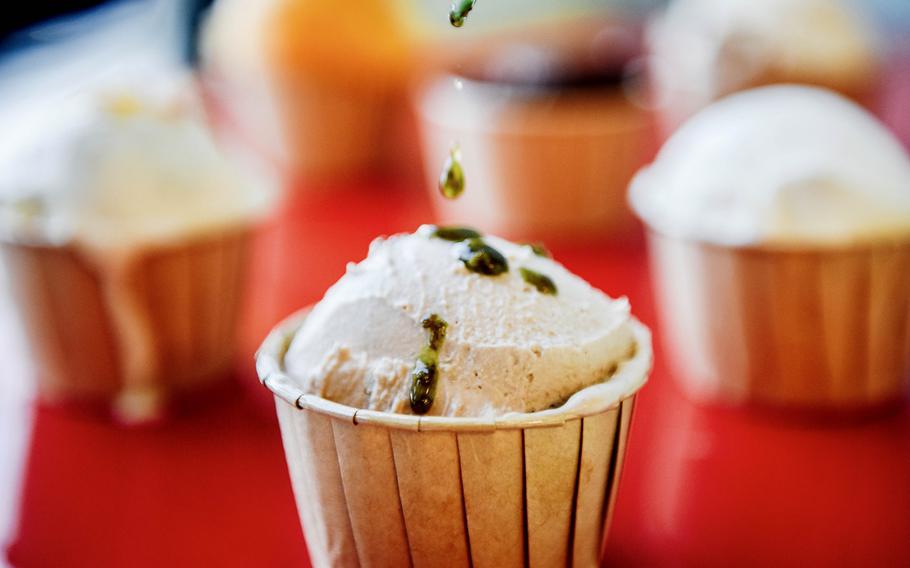 Final touches are put on a scoop of ice cream at a shop in Bahrain.