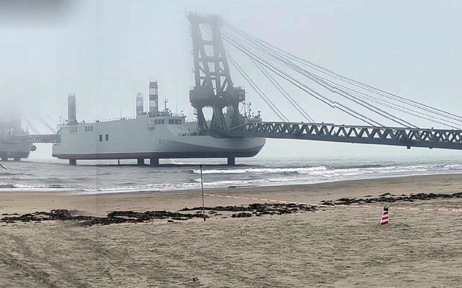 China’s bridge barges connect to a beach.