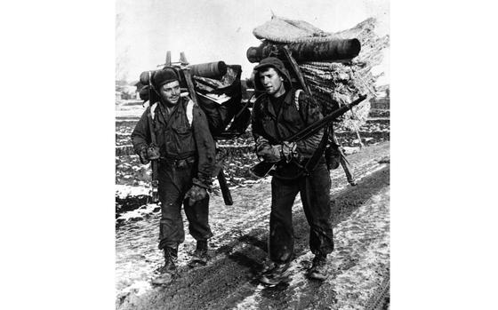 Somewhere near the DMZ, South Korea, December 1950: Two I Corps soldiers use the traditional Korean A-frame - also known as a jige - to carry supplies up to the front near Munsan-ni, South Korea in December 1950. The traditional pack frame would become heavily used by U.S. forces during the Korean War to transport supplies and ammunition in mountainous areas during the war. 

Looking for additional Stars and Stripes’ coverage of the Korean War? Subscribe to Stars and Stripes’ historic newspaper archive! We have digitized our 1948-1999 European and Pacific editions, as well as several of our WWII editions and made them available online through https://starsandstripes.newspaperarchive.com/

META TAGS: South Korea; military gear; military supplies; Korean War; I Corps; mud; U.S. Army; jige; pack frame