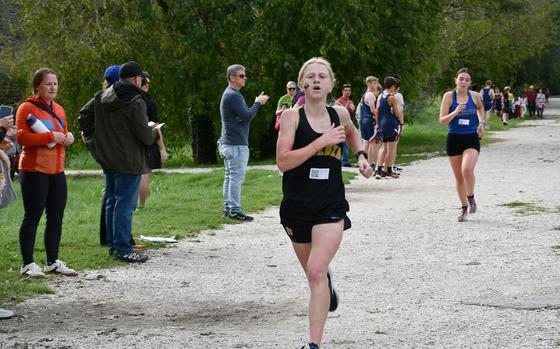 Vicenza freshman Kelsie Torgesen sped across the finish line in first place Saturday, Sept. 14, 2024, trailed by Rota's Lila Cypers.