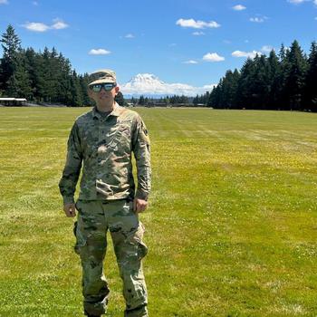 Army Chief Warrant Officer 3 Hao Y. Li in an undated photo at Joint Base Lewis-McChord, Wash., with Mount Rainier in the background. Li died July 15, 2025, of an apparent drowning at American Lake at the base. He served nearly 19 years in the Army, including two deployments to Iraq.