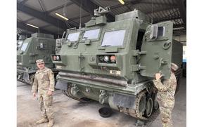 Soldiers from 1st Battalion, 6th Field Artillery's Bravo Battery inspect their M270A2 Multiple Launch Rocket System at the battalion's motor pool in Grafenwoehr, Germany, on Sept. 24, 2024. The new mobile armored launcher was fired at the Grafenwoehr Training Area for the first time on Sept. 12.