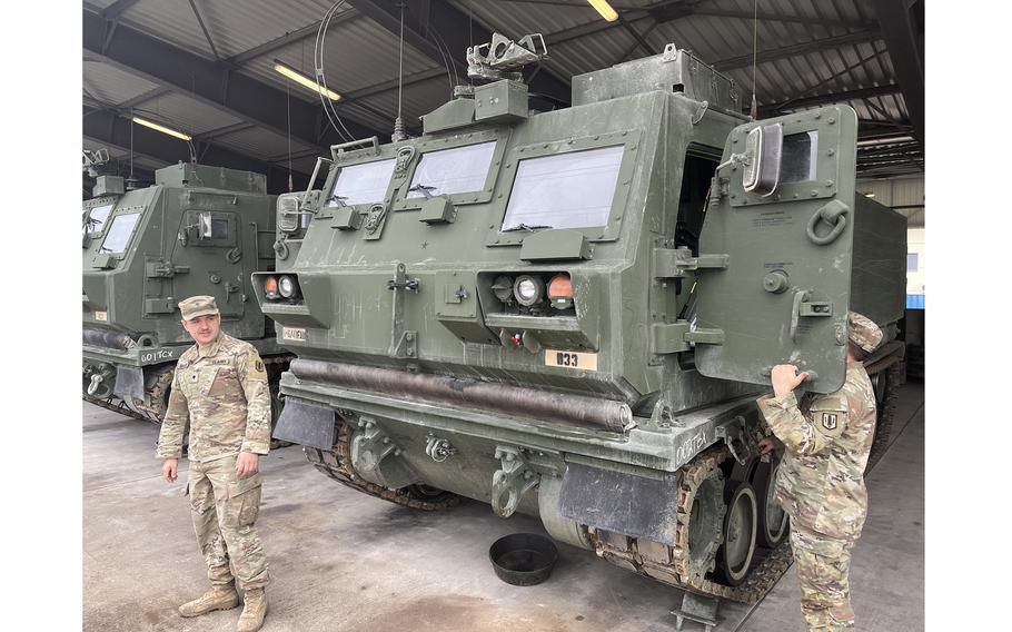 Soldiers inspect their M270A2 Multiple Launch Rocket System