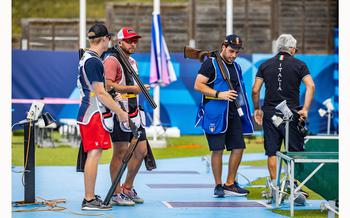 Army veteran Vincent Hancock talks with teammate Conner Prince, left, during the pre-event training for the men’s skeet at the 2024 Paris Olympics on Thursday, Aug. 1, 2024, at the Chateauroux Shooting Centre in Chateauroux, France.