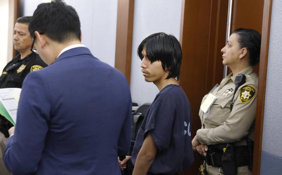 Joshua Robles, center, who is facing terrorism-related charges, appears in court during a hearing at the Regional Justice Center, on Wednesday, Aug. 21, 2024, in Las Vegas. (Bizuayehu Tesfaye/Las Vegas Review-Journal) @bizutesfaye