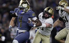 Notre Dame running back Jeremiyah Love scores a touchdown during the first half of an NCAA college football game against Army at Yankee Stadium on Saturday, Nov. 23, 2024, in New York. (AP Photo/Adam Hunger)