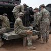 U.S. soldiers assigned to the 5th Squadron, 7th Cavalry Regiment do maintenance work on an Armored Multi-Purpose Vehicle at Camp Reedo, Estonia, March 13, 2025.