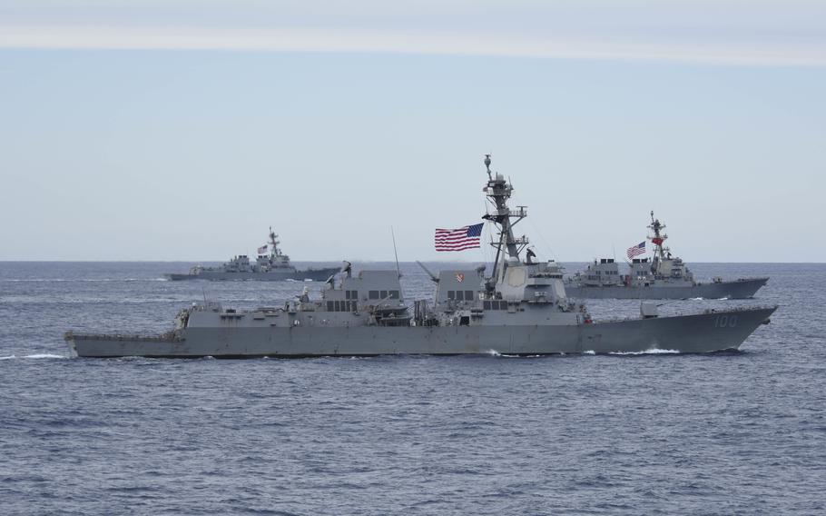 The USS Kidd, USS Howard and USS Shoup participate in a group sail in 2017 in the Pacific Ocean. 