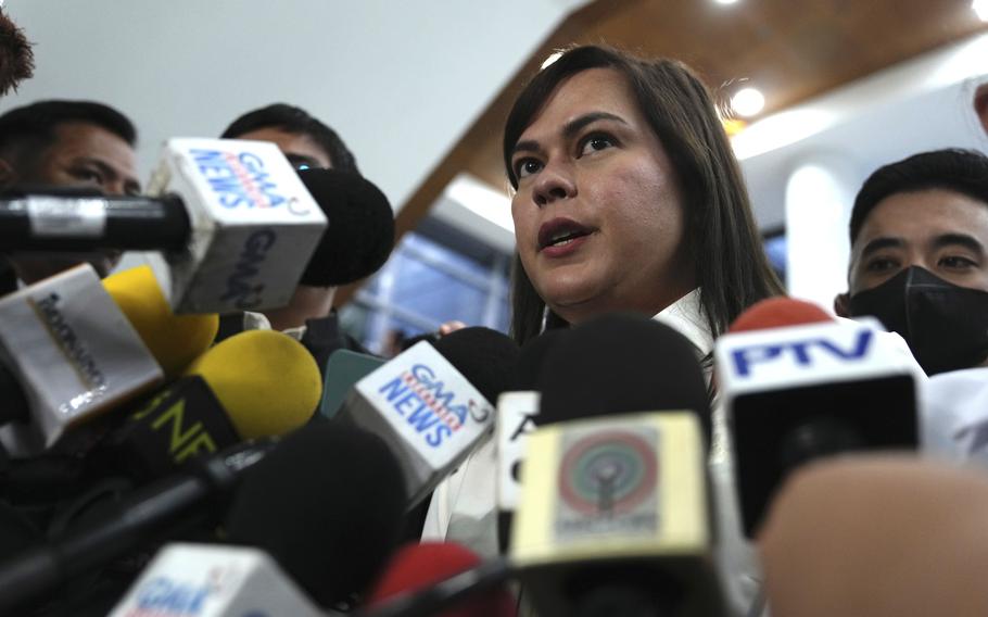 Philippine Vice President Sara Duterte speaks while surrounded by microphones from reporters in Quezon City, Philippines, Nov. 25, 2024.