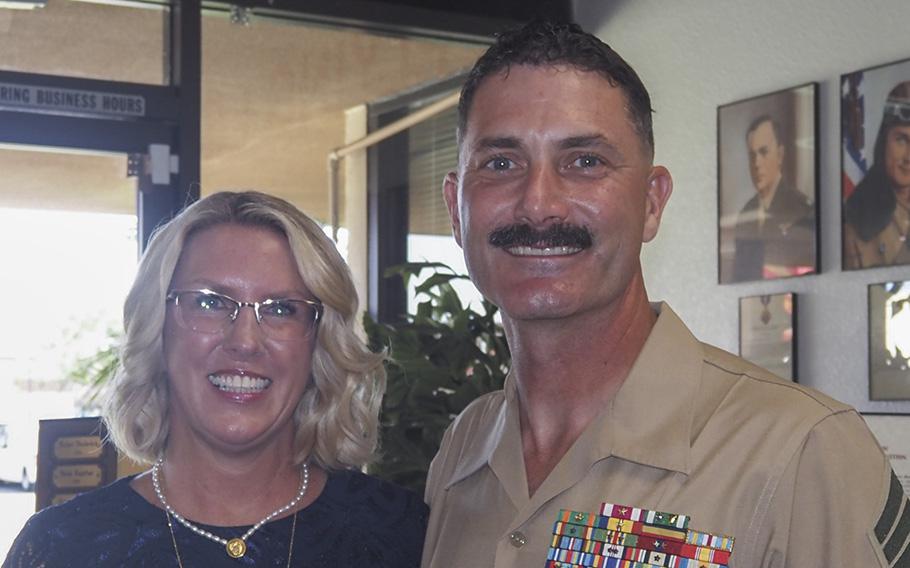 Master Gunnery Sgt. Shawn Hughes stands beside his wife Kyp who was selected as the winner of the 2022 Irene Ferguson Marine Wife Recognition Award competition.