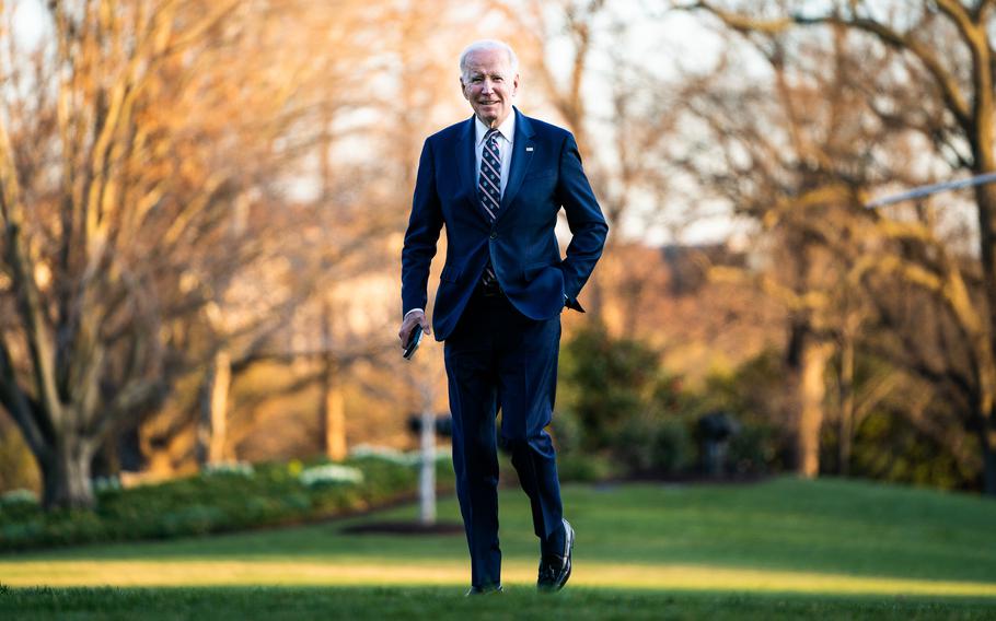 President Biden makes his way to the White House residence on the South Lawn on March 9, 2023.