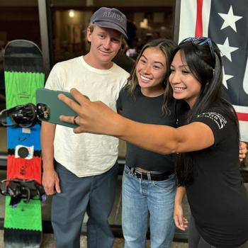 Red Gerard and Hailey Langland pose for a selfie with Ermguard Vargas Escobar during a meet-and-greet at Fort Greely.