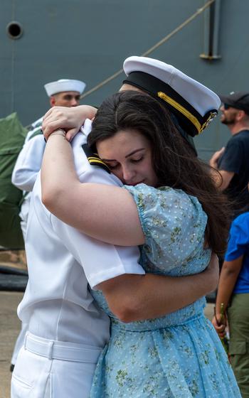 Lt. j.g. Shane Marczak embraces his wife upon Laboon’s return 