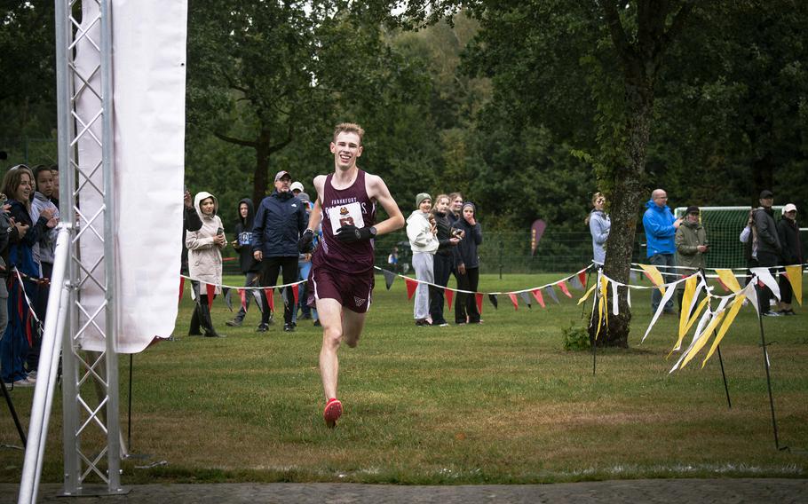 Frankfurt International senior Seth Leishman smiles while taking first place in a large cross country meet on Rose Barracks, Sept. 14, 2024.