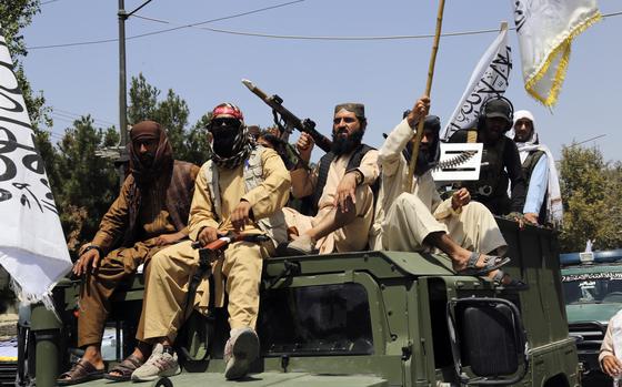 Taliban fighters celebrate the third anniversary of the withdrawal of US-led troops from Afghanistan, in Kabul, Afghanistan, Wednesday, Aug. 14, 2024. (AP Photo/Siddiqullah Alizai)