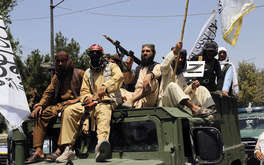 Taliban fighters celebrate the third anniversary of the withdrawal of US-led troops from Afghanistan, in Kabul, Afghanistan, Wednesday, Aug. 14, 2024. 