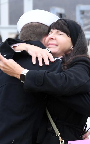 A sailor embraces his loved one