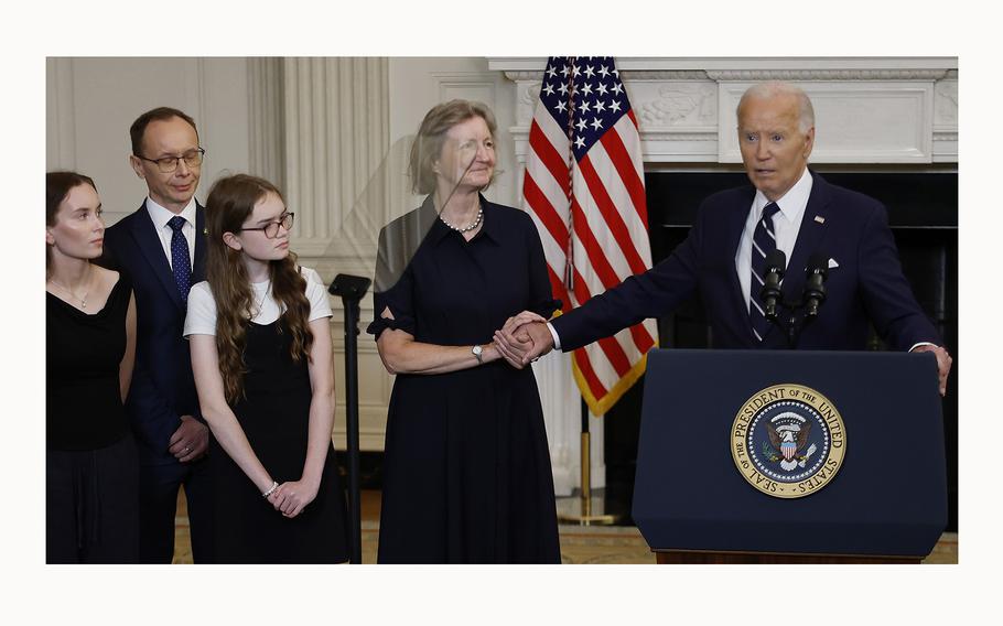 U.S. President Joe Biden at the White House on Aug. 1, 2024, in Washington, D.C., holds hands with Elizabeth Whelan, sister of freed American prisoner Paul Whelan, as he announces the release of Whelan, Wall Street Journal Reporter Evan Gershkovich and others from Russian prison.