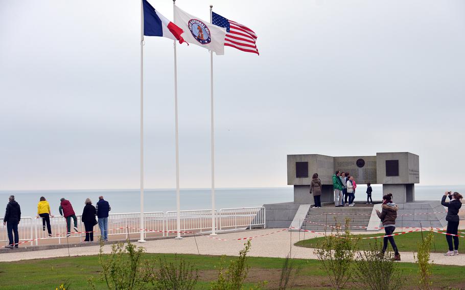 The National Guard Memorial at Vierville-sur-Mer on Omaha Beach stands on a former German gun position. The inscriptions inside the U-shaped monument tell the National Guard’s story in English and French.