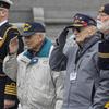 Battle of the Bulge veterans Frank Cohn, left, and Harry Miller, salute the presentation of the colors during the battleÕs 80th Anniversary wreath laying at the World War II MemorialÕs Circle of Remembrance, Dec. 16, 2024 in Washington. (Eric Kayne/Stars and Stripes)