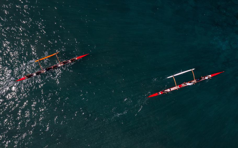 Members of the Lahaina Canoe Club paddle out from Hanakaoʻo Beach in honor of Carole Hartley. 