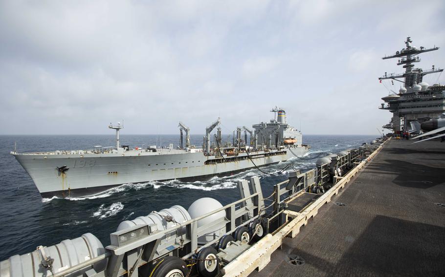 Henry J. Kaiser-class fleet replenishment oiler USNS Big Horn sailing alongside the aircraft carrier USS Abraham Lincoln on Sept. 11, 2024, at an undisclosed location at sea in the Middle East. The Big Horn sustained damage in an incident that is under investigation, officials said Tuesday, Sept. 24, 2024. 