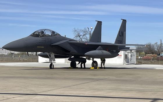 An F-15E Strike Eagle sits on a flight line in San Antonio on Jan. 15, 2025. The aircraft, recently upgraded with a new advanced electronic warfare system, arrived at RAF Lakenheath in England on Jan. 16, 2025.  