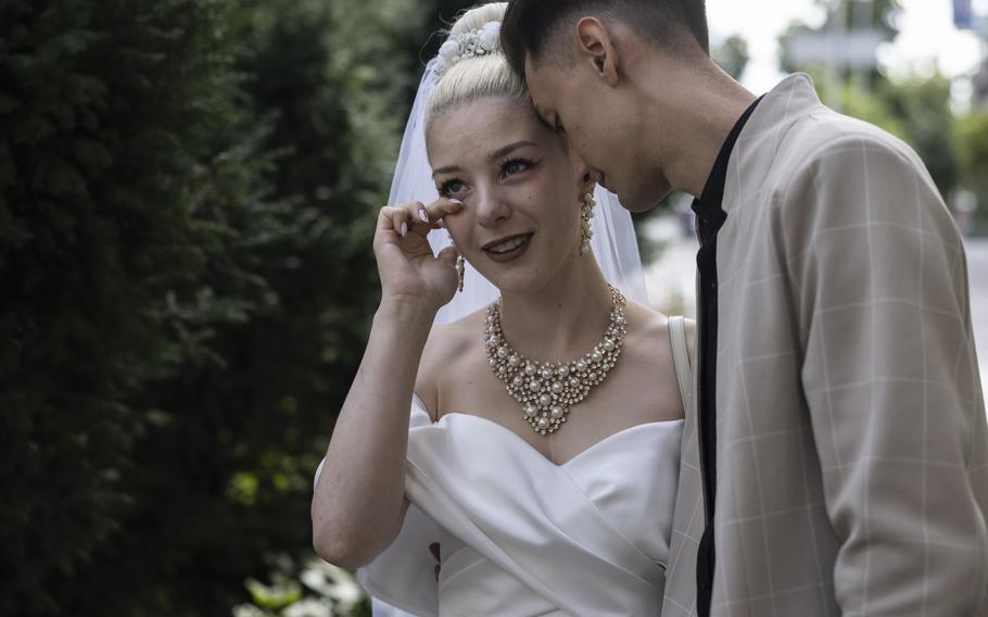 Between their wedding day and when they were able to take formal photos, newlyweds Daryna and Yevgen Herasymenko learned that her brother had been killed in the war.