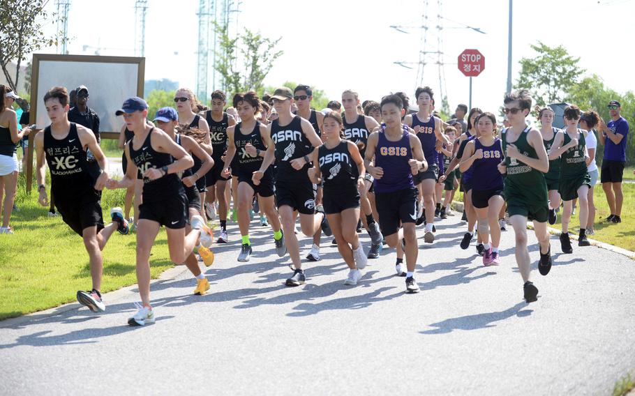 Cross country runners in South Korea began a race.