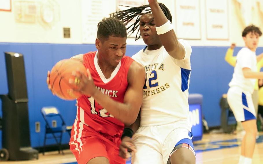 Nicholas Whyte drives against Jai Bailey.