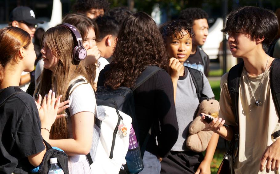 Students head to Zama Middle High School on the first day of classes at Camp Zama, Japan, Monday, Aug. 21, 2023.