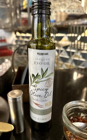 Olive oil infused with red pepper is available at every table at Melenzane to drizzle over dishes.