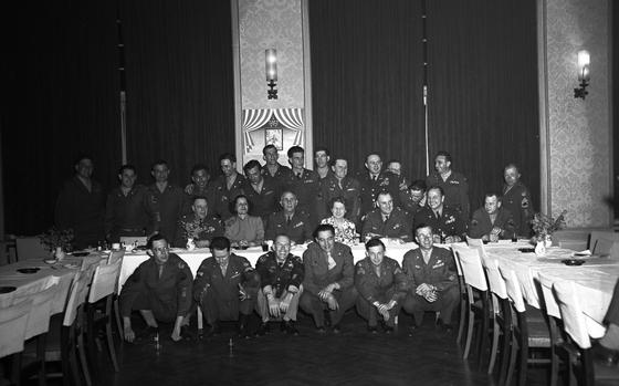 Group photo of 28 of the 30 survivors of the Bataan Death March who attended their second reunion held at the Bahnhof Hotel in Darmstadt, Germany, April 8-9, 1949. All survivors served in the European Theater of Command (EC) at the time of the reunion. The two women in the picture are most likely Mrs. Earleen Francis and Mrs. Carmen Sewell who both served as Army nurses and survived the Bataan march and married fellow survivors. A third U.S. Army nurse survivor who also attended the reunion was 1st Lt. Eleanor M. Garen. 